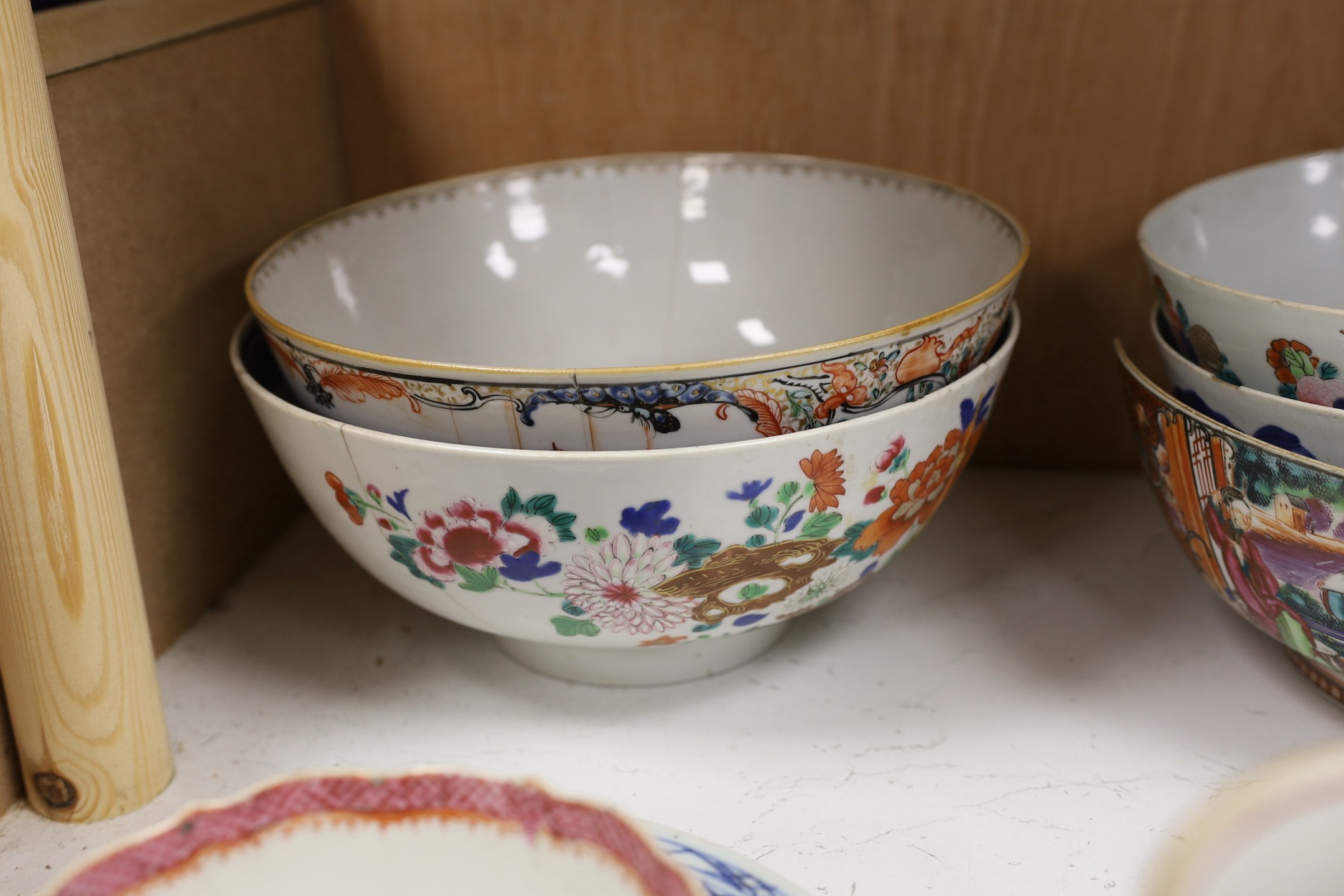 A large selection of 18th century Chinese export porcelain bowls, plates and mugs a/f